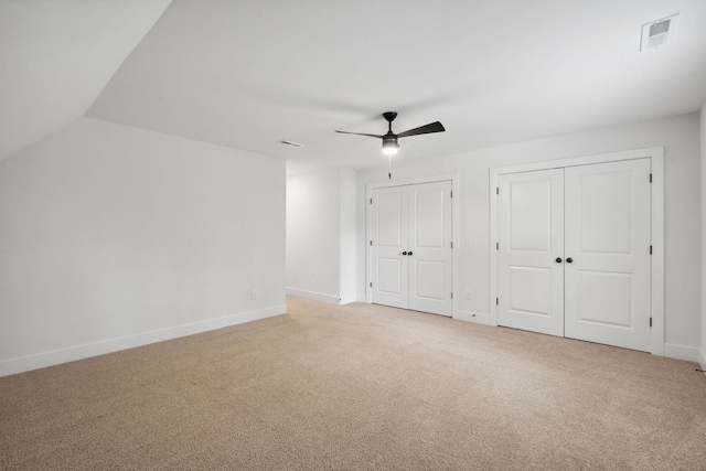962 Belmont Rd, Clarksville, TN 37040 - unfurnished bedroom with multiple closets, light colored carpet, baseboards, and ceiling fan