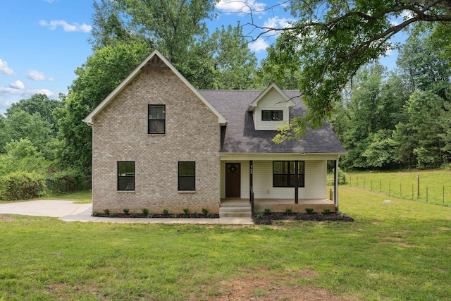 962 Belmont Rd, Clarksville, TN 37040 - view of front of house with covered porch, brick siding, and roof with shingles