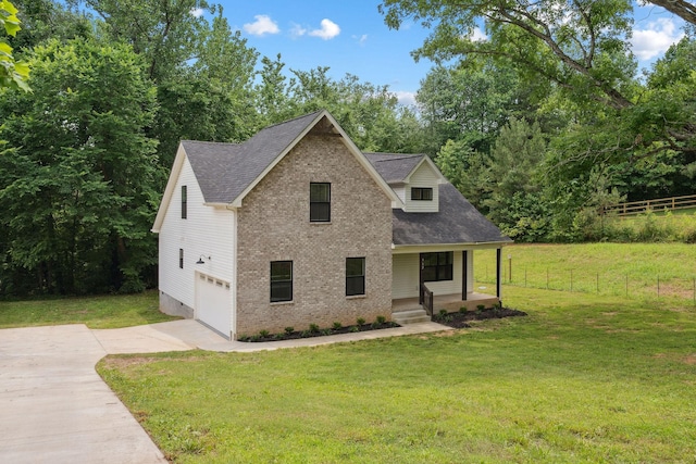 962 Belmont Rd, Clarksville, TN 37040 - view of front of house with driveway, covered porch, an attached garage, brick siding, and a shingled roof