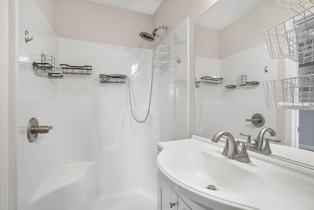 bathroom with vanity and walk in shower