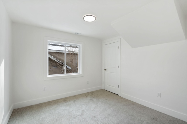 bonus room with baseboards, carpet floors, and visible vents