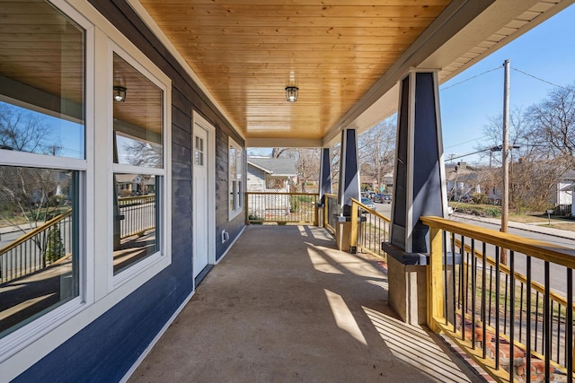 view of patio / terrace with a porch and a residential view