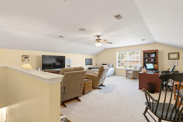 living room with lofted ceiling, ceiling fan, visible vents, and light colored carpet