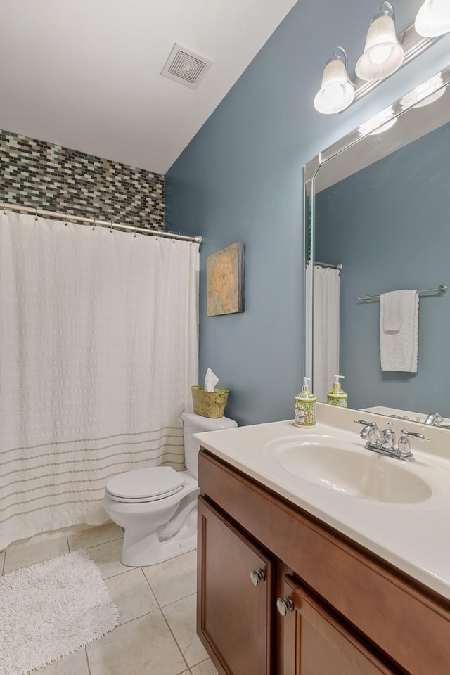 full bath with toilet, vanity, visible vents, and tile patterned floors