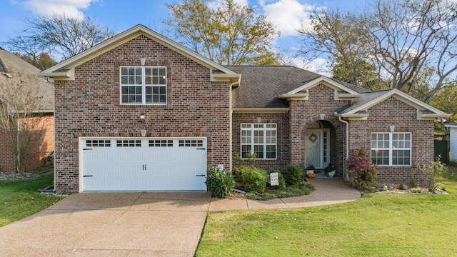 traditional home featuring a garage, a shingled roof, brick siding, driveway, and a front lawn