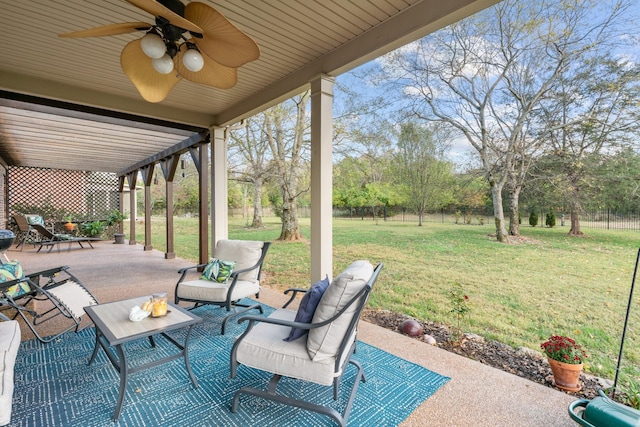 view of patio featuring ceiling fan, outdoor lounge area, and a fenced backyard