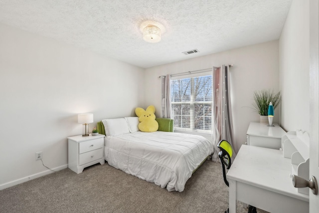 bedroom with light carpet, visible vents, a textured ceiling, and baseboards