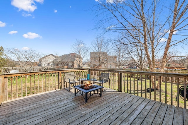 deck featuring an outdoor fire pit