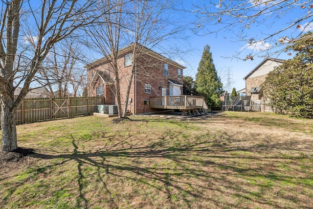 view of yard featuring cooling unit, a fenced backyard, and a wooden deck