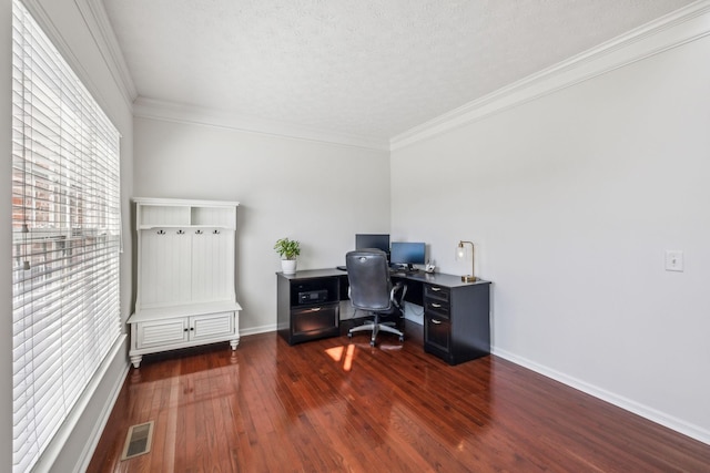 office space with wood finished floors, visible vents, baseboards, a textured ceiling, and crown molding