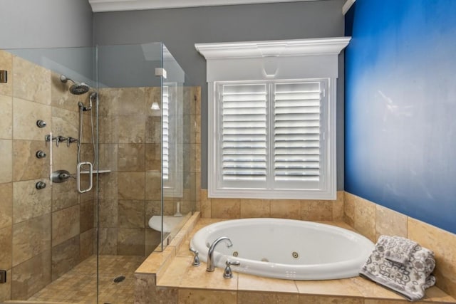 bathroom with a whirlpool tub and a shower stall