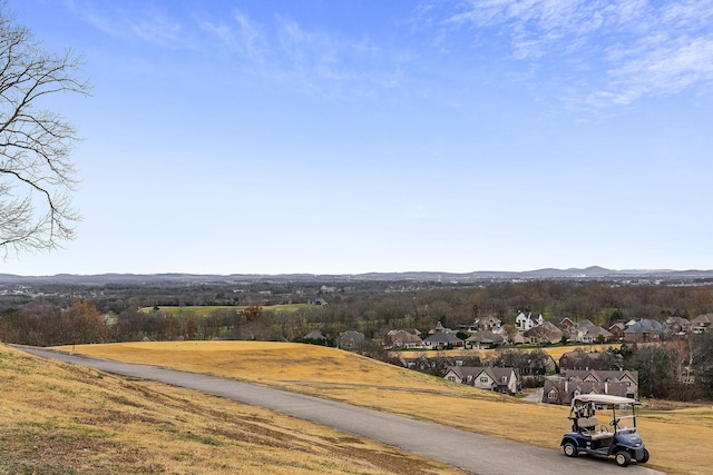 view of street with a residential view and a mountain view