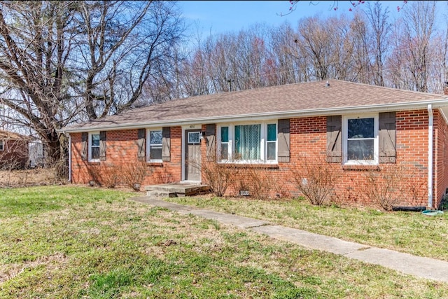 ranch-style house featuring crawl space, brick siding, a front lawn, and a shingled roof