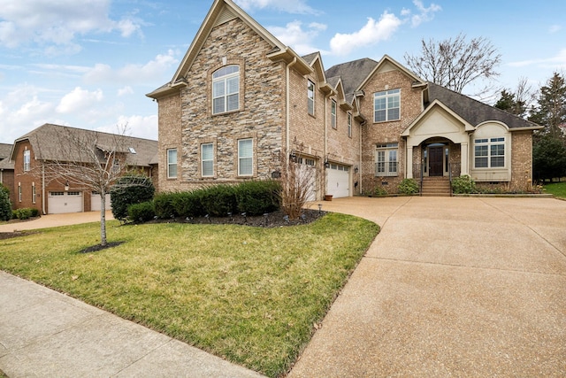 traditional-style house featuring concrete driveway, stone siding, an attached garage, crawl space, and a front lawn