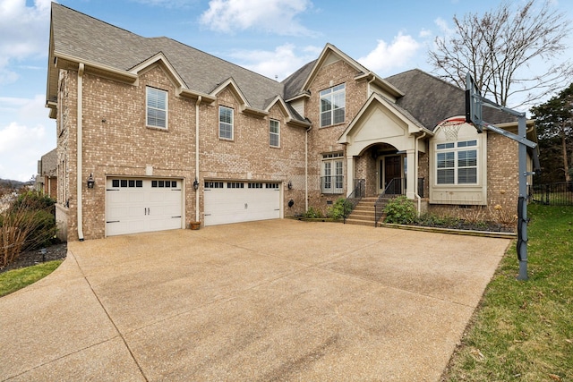 view of front facade featuring a garage, brick siding, driveway, and a shingled roof