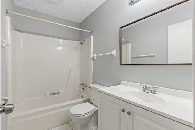 full bathroom featuring bathing tub / shower combination, toilet, marble finish floor, a textured ceiling, and vanity