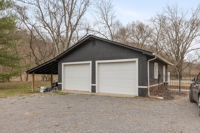 garage with a garage and fence