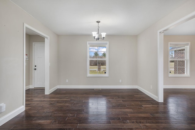 unfurnished dining area with baseboards, dark wood-type flooring, and a healthy amount of sunlight