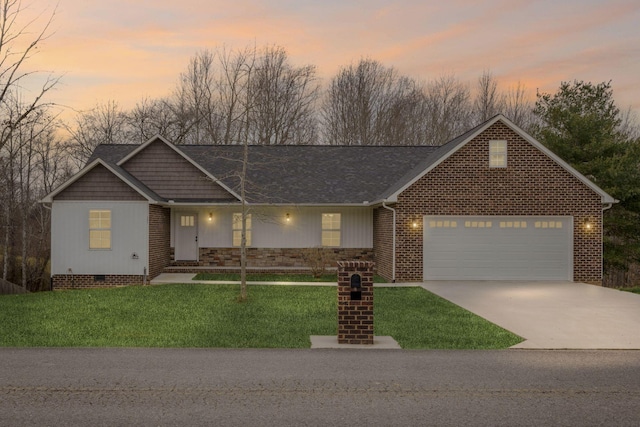 view of front of property featuring a front lawn, an attached garage, concrete driveway, and crawl space