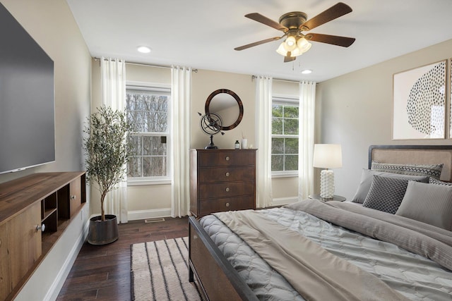 bedroom featuring ceiling fan, baseboards, wood finished floors, and recessed lighting