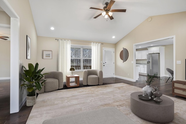 living room featuring lofted ceiling, dark wood finished floors, recessed lighting, baseboards, and ceiling fan