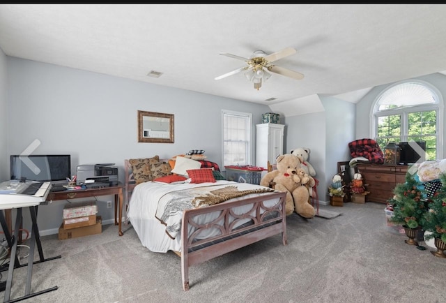 bedroom featuring carpet, lofted ceiling, visible vents, ceiling fan, and baseboards