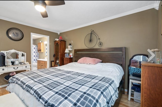 bedroom with light wood finished floors, ensuite bath, ceiling fan, and crown molding