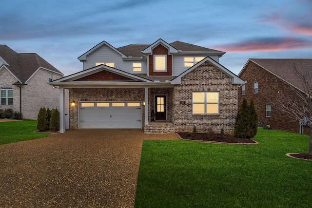 traditional-style home with driveway, a yard, roof with shingles, a garage, and brick siding