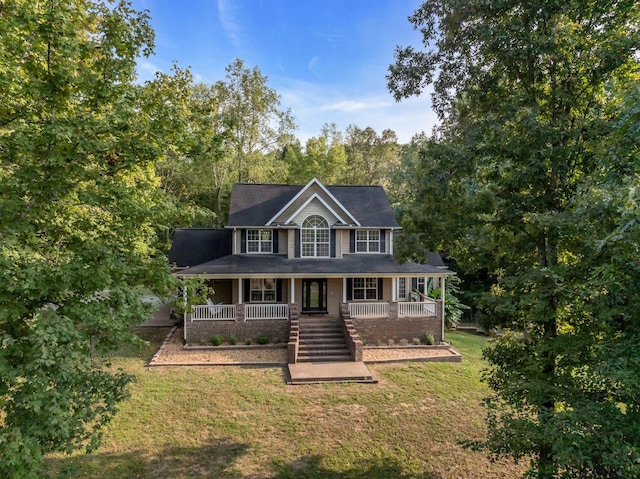 view of front facade with covered porch and a front lawn