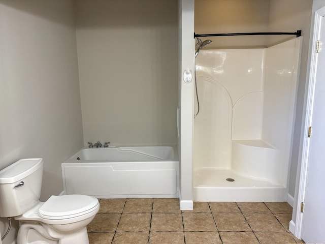 full bathroom with tile patterned floors, a garden tub, toilet, and walk in shower