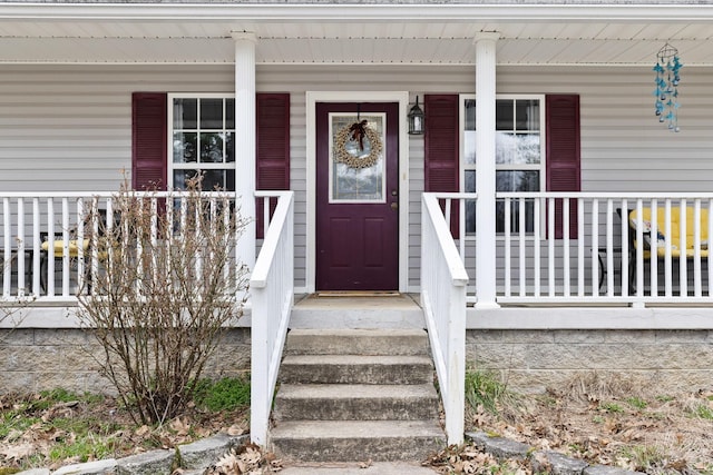 property entrance with covered porch