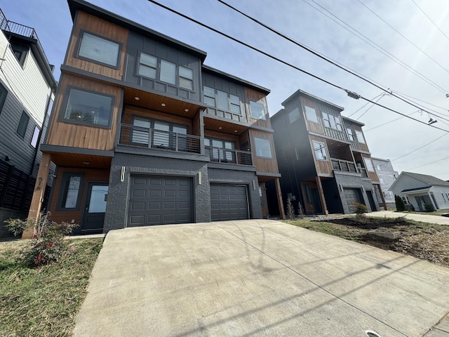 view of front of home featuring a garage, brick siding, and driveway