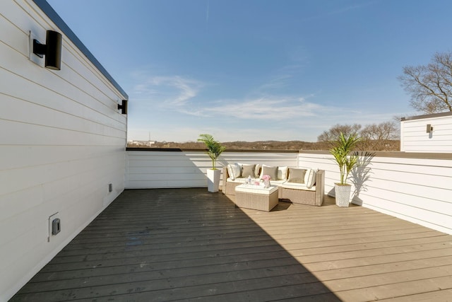 wooden deck with outdoor lounge area