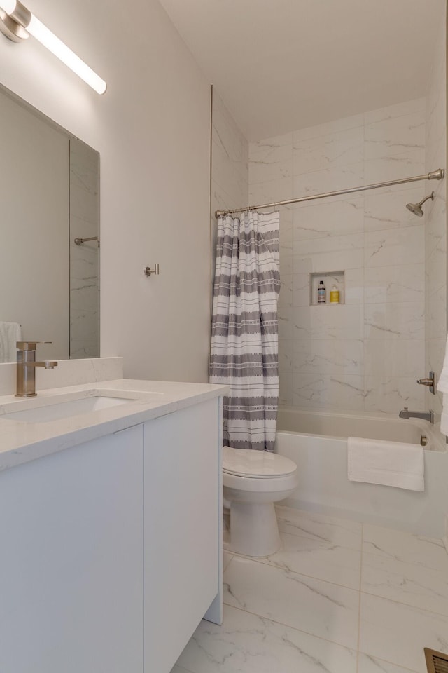 full bathroom with marble finish floor, shower / bath combo with shower curtain, vanity, and toilet