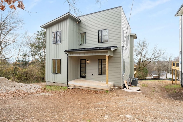 back of property featuring crawl space, a porch, board and batten siding, and cooling unit