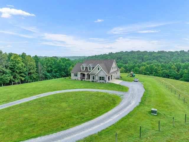 drone / aerial view featuring a forest view and a rural view