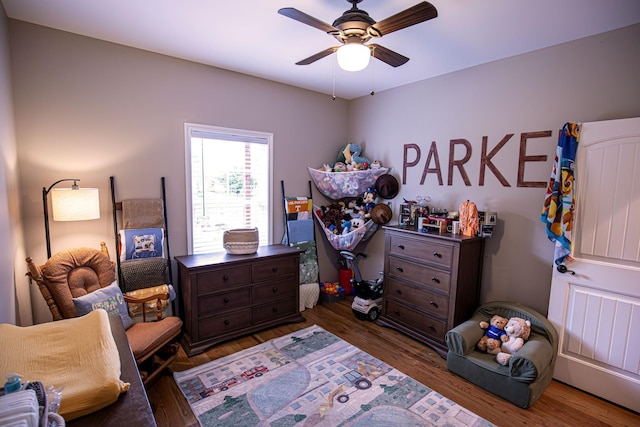 bedroom with a ceiling fan and wood finished floors