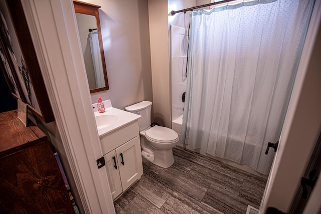 full bath featuring vanity, toilet, and shower / bath combo with shower curtain