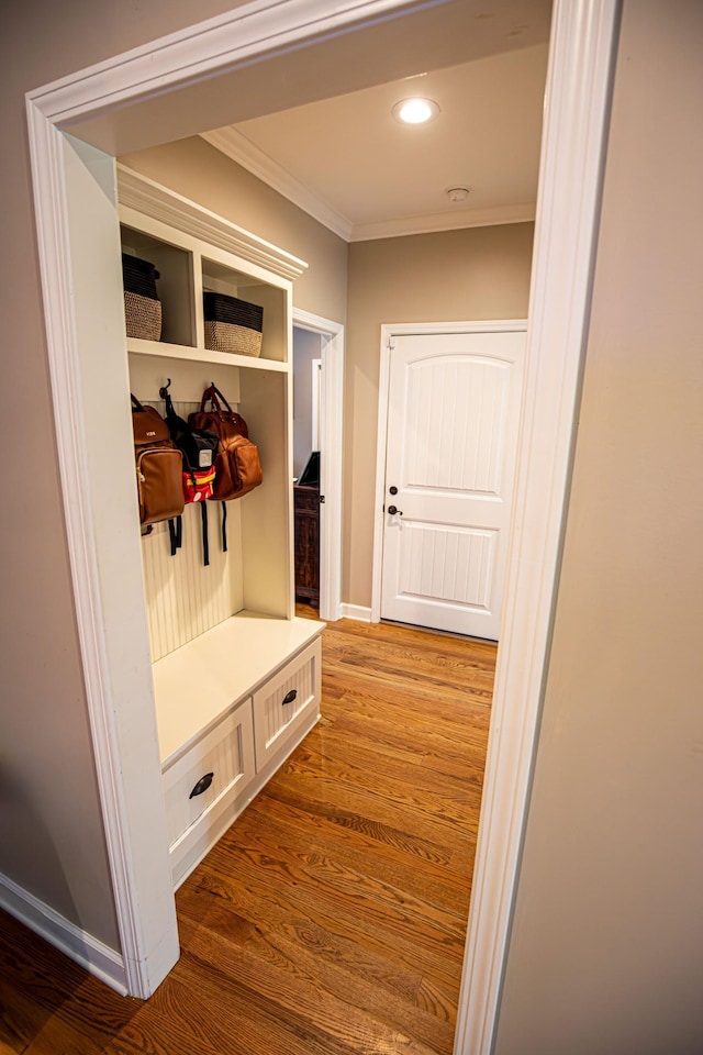 mudroom featuring baseboards, ornamental molding, wood finished floors, and recessed lighting