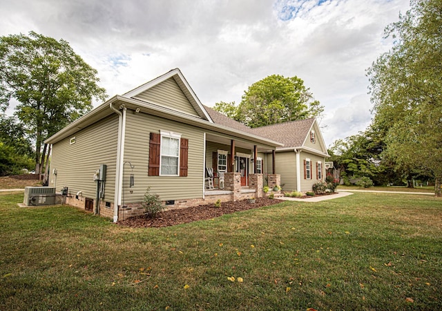 ranch-style house featuring a porch, ac unit, crawl space, and a front lawn