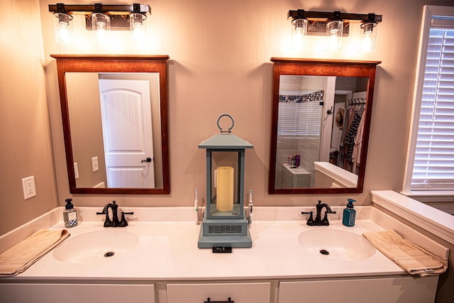 bathroom featuring double vanity and a sink