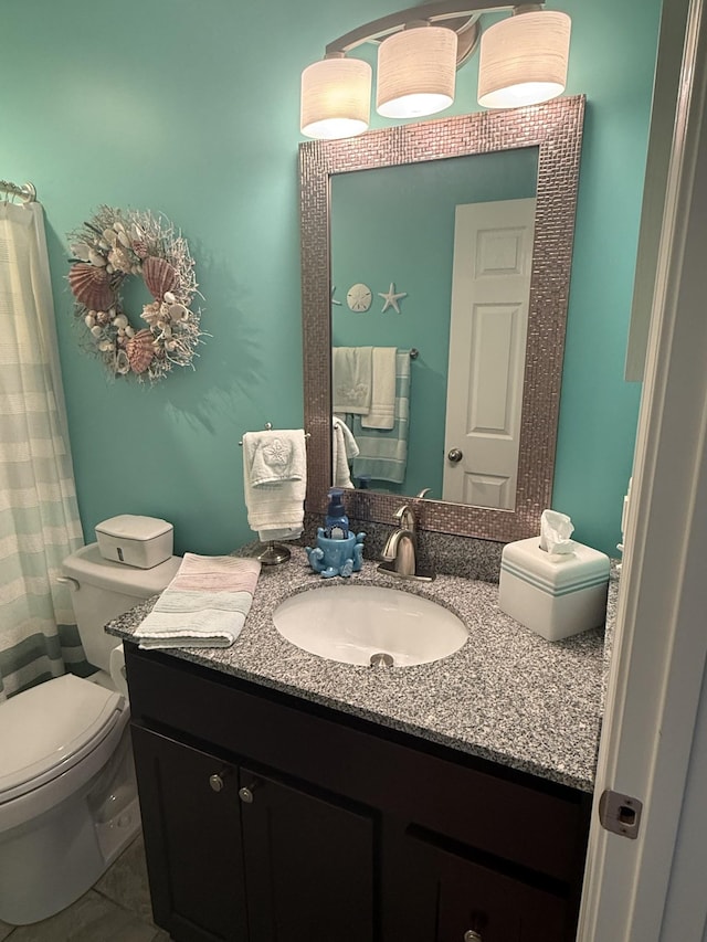 full bath featuring toilet and vanity