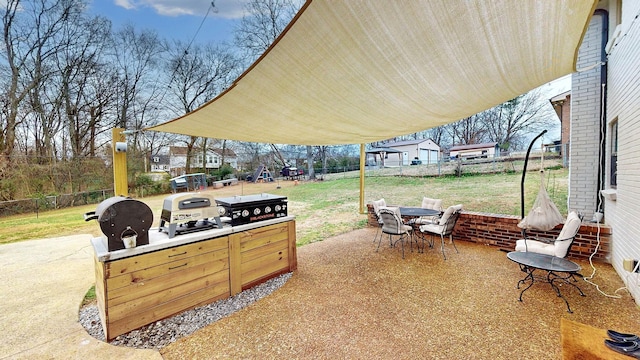 view of patio / terrace with outdoor dining area, fence private yard, and a grill