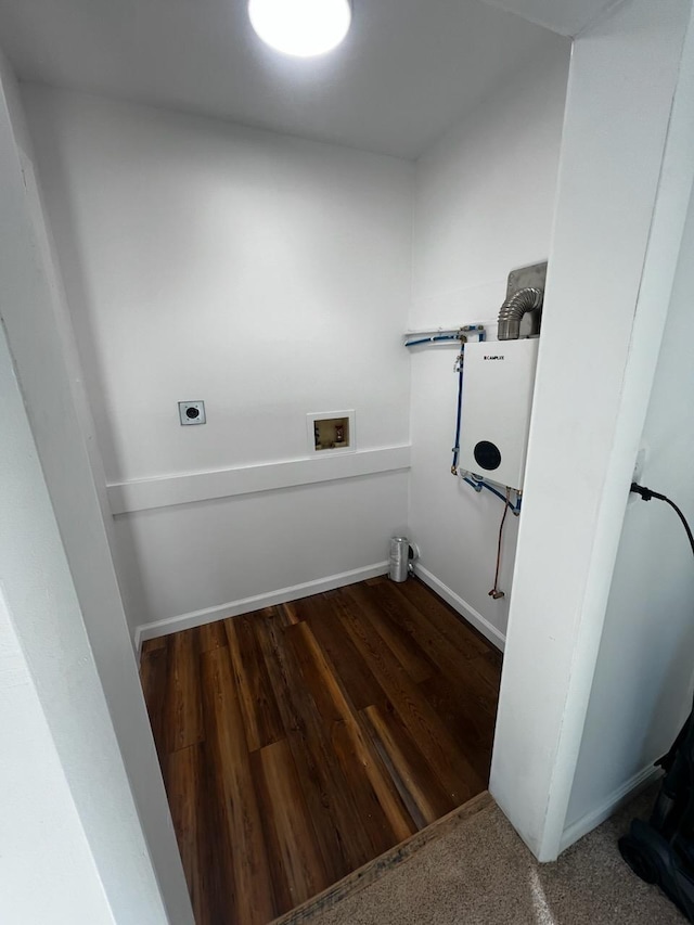 laundry area with laundry area, baseboards, wood finished floors, hookup for a washing machine, and electric dryer hookup