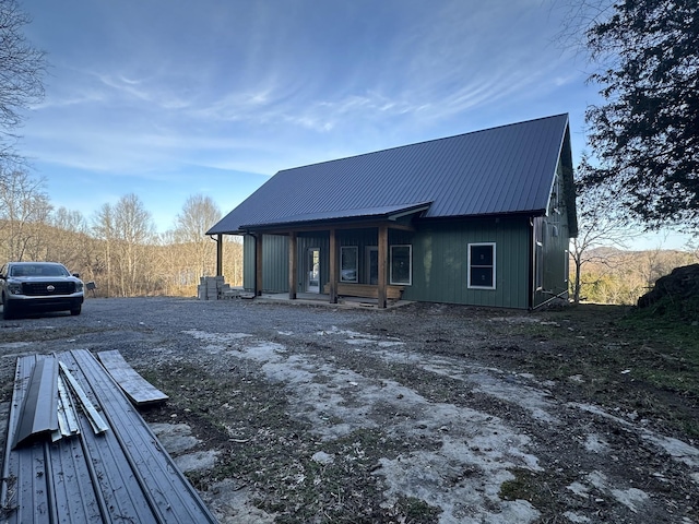 exterior space featuring metal roof