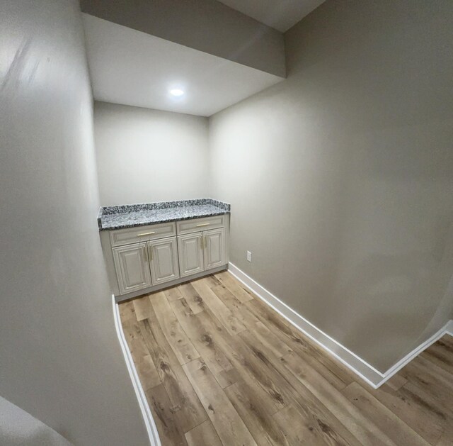 details with recessed lighting, wood finished floors, and baseboards