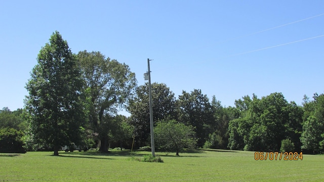 view of home's community featuring a lawn