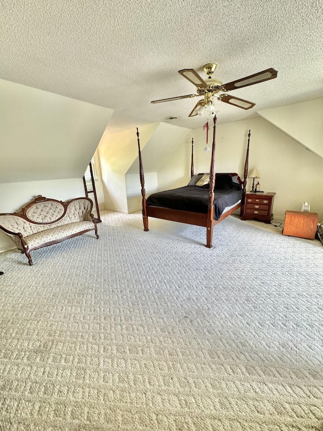 unfurnished bedroom with a ceiling fan, carpet floors, and a textured ceiling