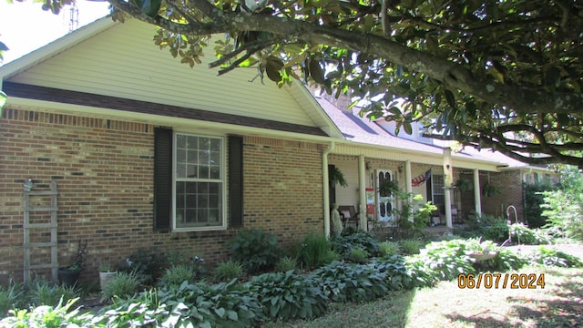 view of front of home with brick siding