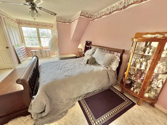 bedroom featuring baseboards, ceiling fan, a textured ceiling, and carpet